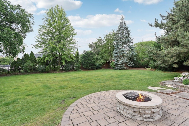 102 E Adelia St, Elmhurst, IL 60126 - view of green lawn featuring a fire pit and a patio area