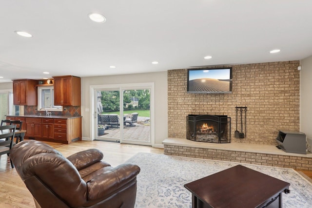 102 E Adelia St, Elmhurst, IL 60126 - living room featuring light wood-style floors, recessed lighting, and a fireplace