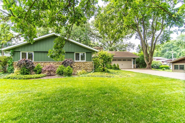 2458 E Cass St, Joliet, IL 60432 - view of front of property featuring driveway, a front lawn, stone siding, and board and batten siding