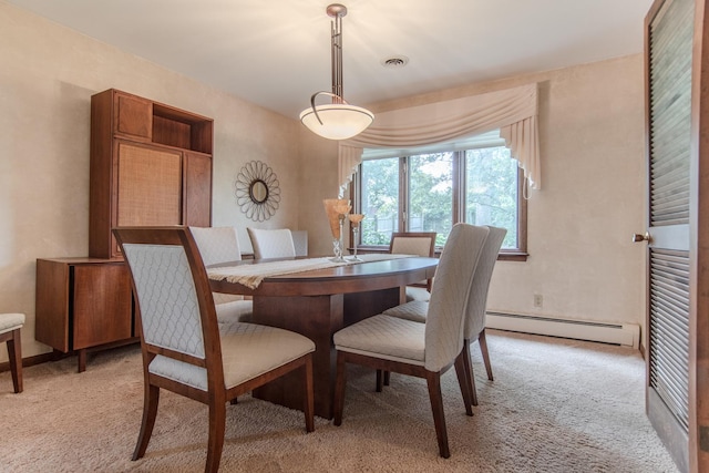 2458 E Cass St, Joliet, IL 60432 - dining space with a baseboard radiator and light colored carpet