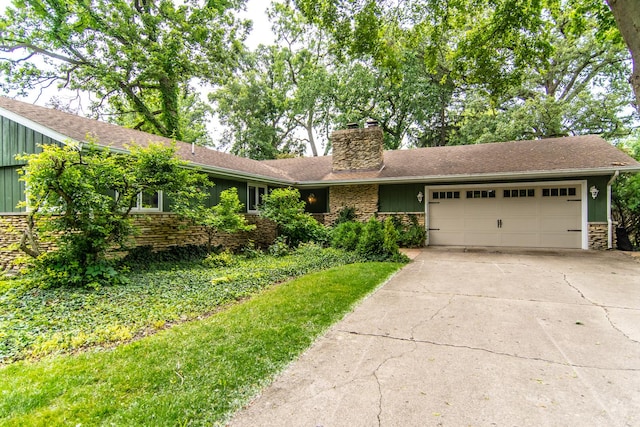 2458 E Cass St, Joliet, IL 60432 - ranch-style home with a chimney, an attached garage, driveway, stone siding, and board and batten siding