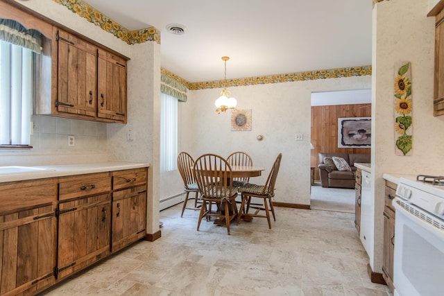 2458 E Cass St, Joliet, IL 60432 - dining space featuring healthy amount of natural light and baseboard heating
