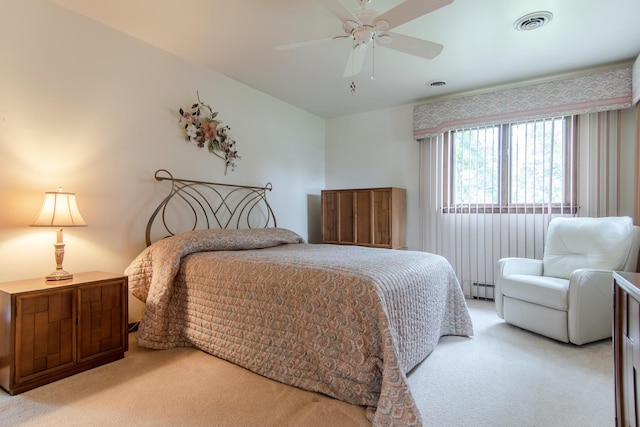 2458 E Cass St, Joliet, IL 60432 - carpeted bedroom featuring baseboard heating and a ceiling fan