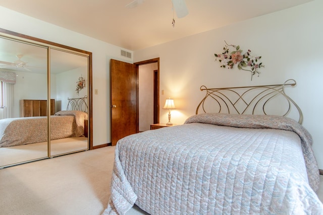 2458 E Cass St, Joliet, IL 60432 - bedroom featuring light colored carpet, a closet, and ceiling fan