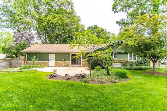 2458 E Cass St, Joliet, IL 60432 - view of front of home with stone siding, a patio, and roof with shingles