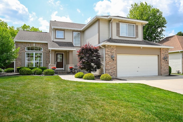 678 Larch Dr, Carol Stream, IL 60188 - traditional home featuring concrete driveway, a garage, a front yard, and brick siding
