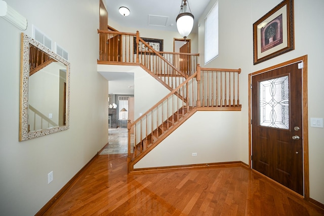 678 Larch Dr, Carol Stream, IL 60188 - foyer entrance with wood finished floors, stairs, and a high ceiling