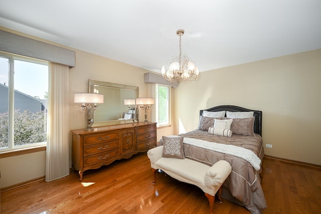 678 Larch Dr, Carol Stream, IL 60188 - bedroom with a chandelier and light wood-style flooring