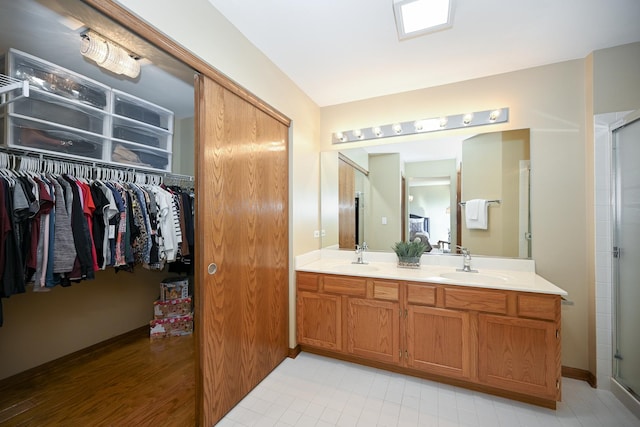678 Larch Dr, Carol Stream, IL 60188 - full bath with double vanity, a stall shower, and a spacious closet