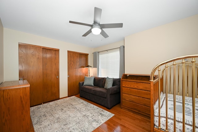 678 Larch Dr, Carol Stream, IL 60188 - bedroom with wood finished floors, two closets, and a ceiling fan