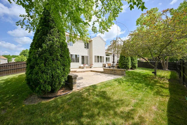678 Larch Dr, Carol Stream, IL 60188 - back of house featuring a fenced backyard and a patio