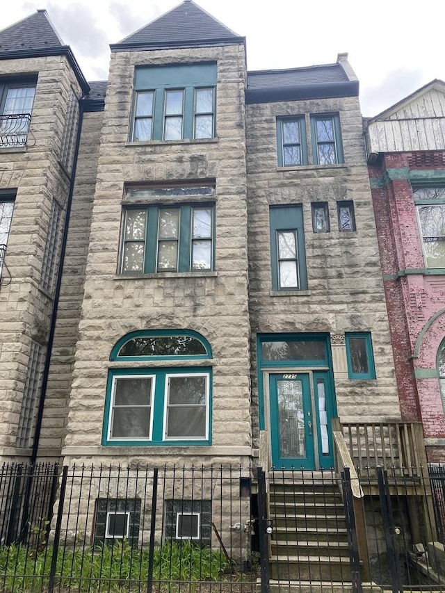 2735 W Washington Blvd, Chicago, IL 60612 - view of front of home featuring a fenced front yard and stone siding