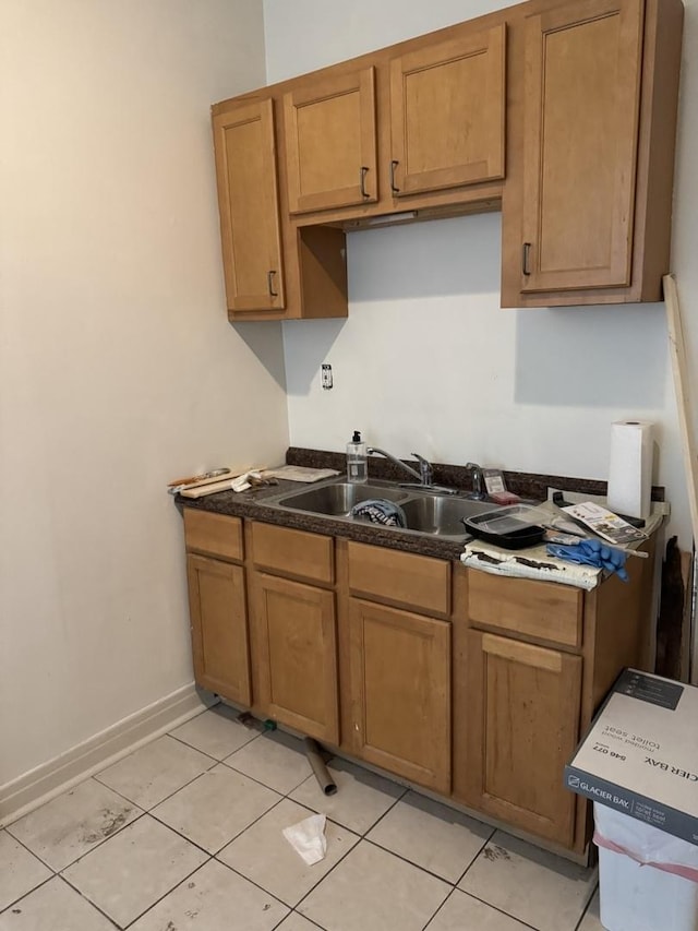 2735 W Washington Blvd, Chicago, IL 60612 - kitchen with light tile patterned floors, brown cabinets, and dark countertops