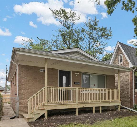 10011 S Princeton Ave, Chicago, IL 60628 - view of front of property with covered porch and brick siding