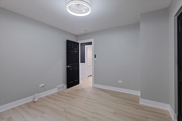 10011 S Princeton Ave, Chicago, IL 60628 - empty room with light wood-type flooring and baseboards