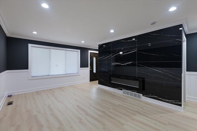 10011 S Princeton Ave, Chicago, IL 60628 - unfurnished living room featuring a wainscoted wall, ornamental molding, wood finished floors, and recessed lighting