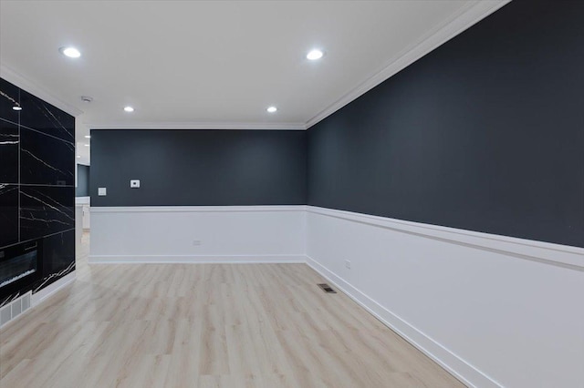 10011 S Princeton Ave, Chicago, IL 60628 - empty room featuring ornamental molding, light wood-style flooring, and recessed lighting