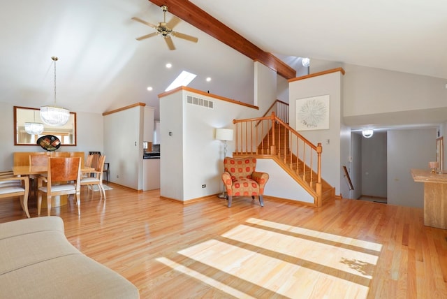 3800 River Rd, Hazel Crest, IL 60429 - living room featuring stairway, wood finished floors, ceiling fan, high vaulted ceiling, and beamed ceiling