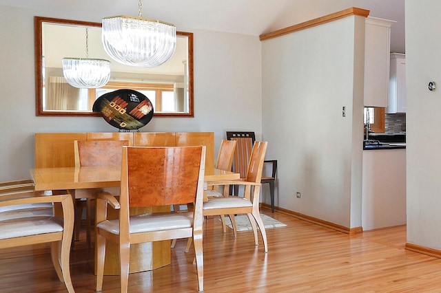 3800 River Rd, Hazel Crest, IL 60429 - dining space with a chandelier, light wood-style flooring, and vaulted ceiling