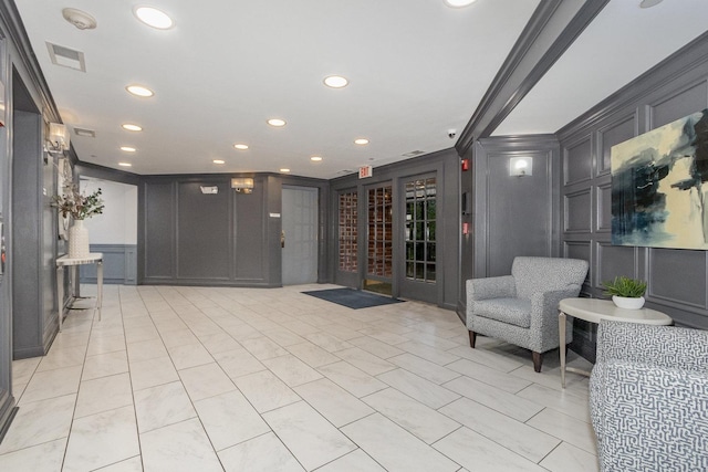 845 E 22nd St Unit 219, Lombard, IL 60148 - building lobby featuring a decorative wall, recessed lighting, a security system, and crown molding