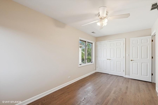 108 Yost Ave, Park Ridge, IL 60068 - unfurnished bedroom featuring wood finished floors, a closet, and a ceiling fan