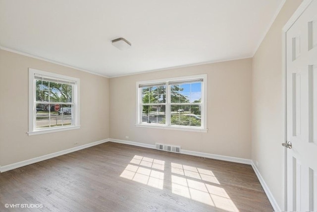 108 Yost Ave, Park Ridge, IL 60068 - spare room with plenty of natural light, wood finished floors, and ornamental molding