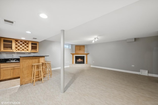 108 Yost Ave, Park Ridge, IL 60068 - indoor wet bar with a warm lit fireplace, recessed lighting, and light colored carpet