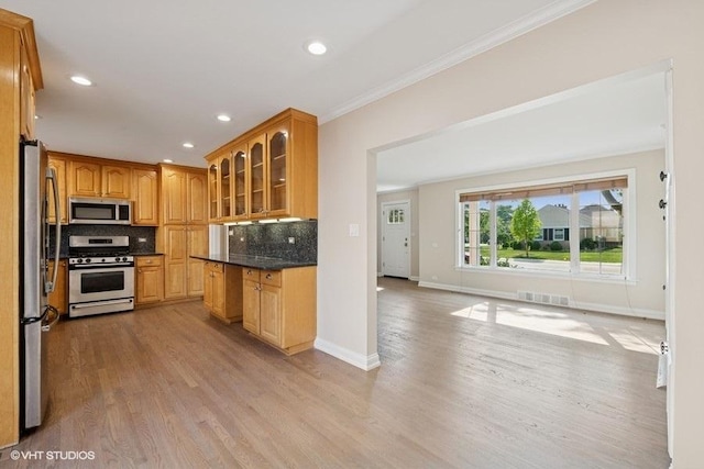 108 Yost Ave, Park Ridge, IL 60068 - kitchen with appliances with stainless steel finishes, light wood-style floors, glass insert cabinets, decorative backsplash, and crown molding