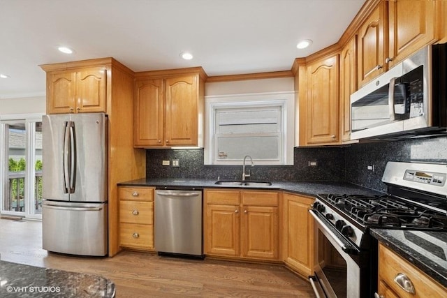 108 Yost Ave, Park Ridge, IL 60068 - kitchen featuring appliances with stainless steel finishes, crown molding, light wood-style floors, backsplash, and recessed lighting