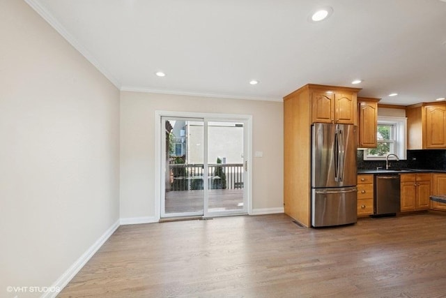 108 Yost Ave, Park Ridge, IL 60068 - kitchen with stainless steel appliances, light wood-type flooring, backsplash, ornamental molding, and dark countertops