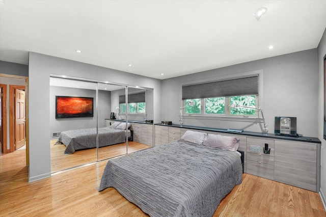 4770 Woodcliff Ln, Palatine, IL 60067 - bedroom with light wood-style floors, a closet, and recessed lighting