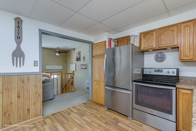 161 Olympic Dr, Bolingbrook, IL 60440 - kitchen with stainless steel appliances, a paneled ceiling, light wood finished floors, and light countertops