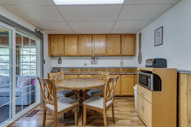 161 Olympic Dr, Bolingbrook, IL 60440 - kitchen featuring stainless steel microwave, light wood-type flooring, and a drop ceiling