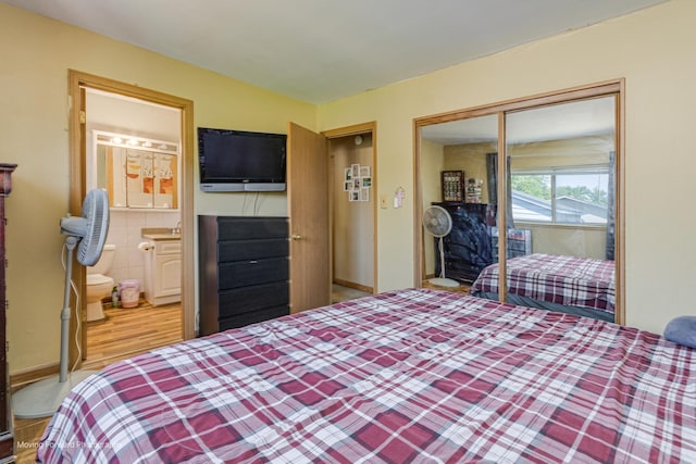 161 Olympic Dr, Bolingbrook, IL 60440 - bedroom with a closet, wood finished floors, and ensuite bathroom