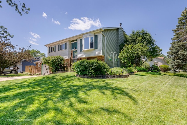161 Olympic Dr, Bolingbrook, IL 60440 - bi-level home featuring a front lawn and brick siding