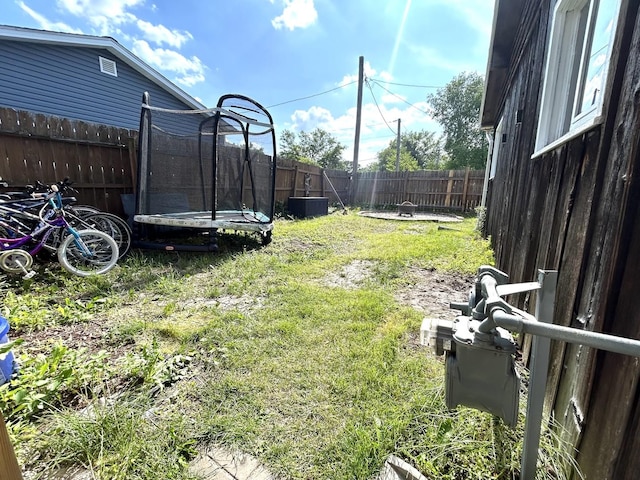 161 Olympic Dr, Bolingbrook, IL 60440 - fenced backyard featuring a trampoline