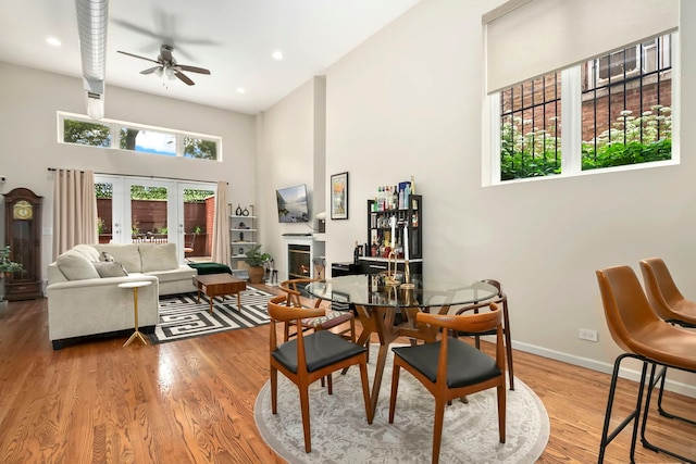 1217 N Greenview Ave Unit G, Chicago, IL 60642 - dining room with a towering ceiling, a ceiling fan, wood finished floors, recessed lighting, and french doors