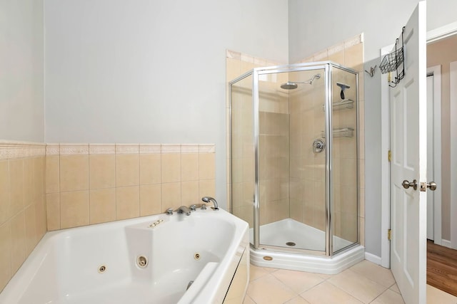 1217 N Greenview Ave Unit G, Chicago, IL 60642 - bathroom with a stall shower, a jetted tub, and tile patterned flooring