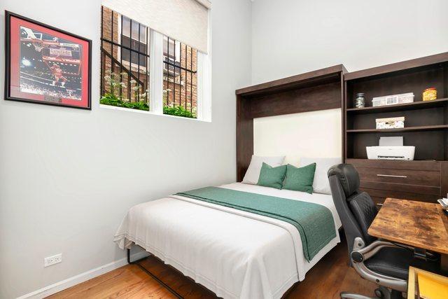 1217 N Greenview Ave Unit G, Chicago, IL 60642 - bedroom featuring wood finished floors and a desk