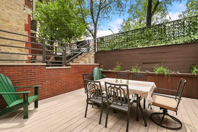 1217 N Greenview Ave Unit G, Chicago, IL 60642 - wooden deck with stairway and outdoor dining space