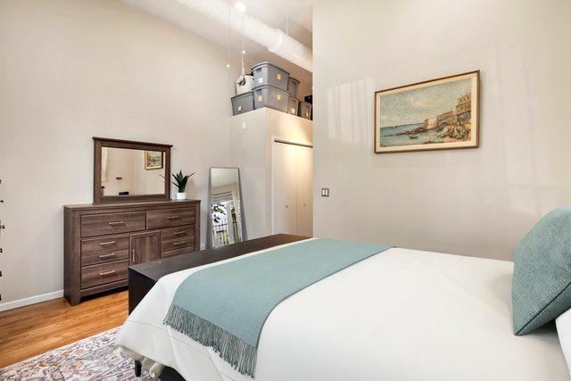 1217 N Greenview Ave Unit G, Chicago, IL 60642 - bedroom with a high ceiling and wood finished floors