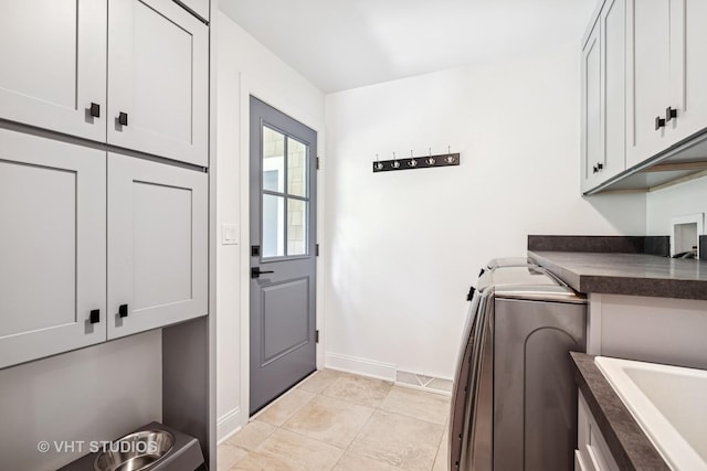 821 Sandstone Dr, Libertyville, IL 60048 - laundry area featuring cabinet space and light tile patterned floors