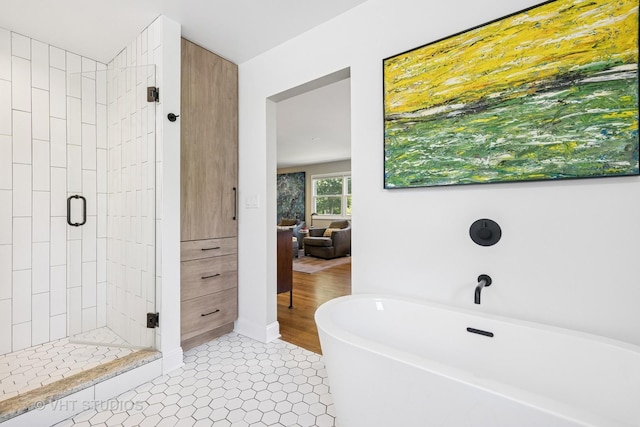 821 Sandstone Dr, Libertyville, IL 60048 - bathroom featuring a freestanding tub, a shower stall, and tile patterned floors