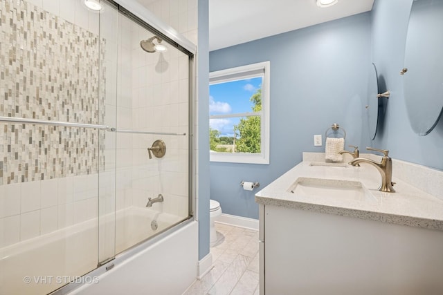 821 Sandstone Dr, Libertyville, IL 60048 - bathroom with marble look tiles, bath / shower combo with glass door, double vanity, and recessed lighting