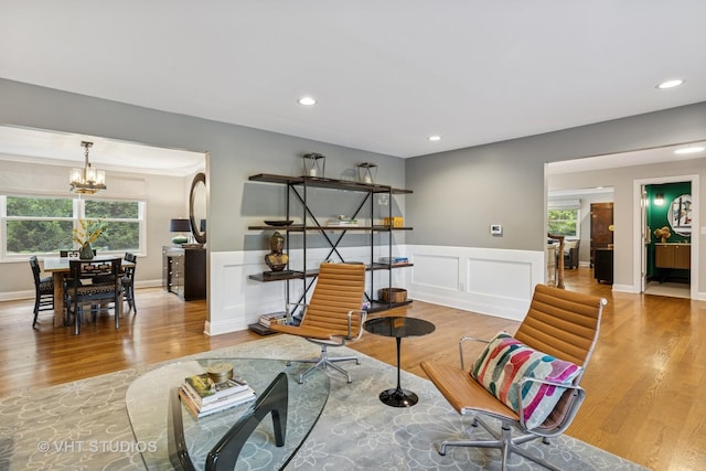 821 Sandstone Dr, Libertyville, IL 60048 - sitting room with healthy amount of natural light, a chandelier, wood finished floors, wainscoting, and recessed lighting