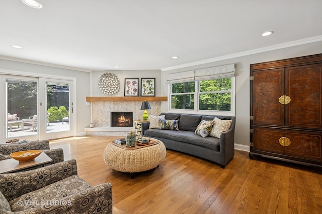 821 Sandstone Dr, Libertyville, IL 60048 - living area with crown molding, wood finished floors, recessed lighting, and a tiled fireplace