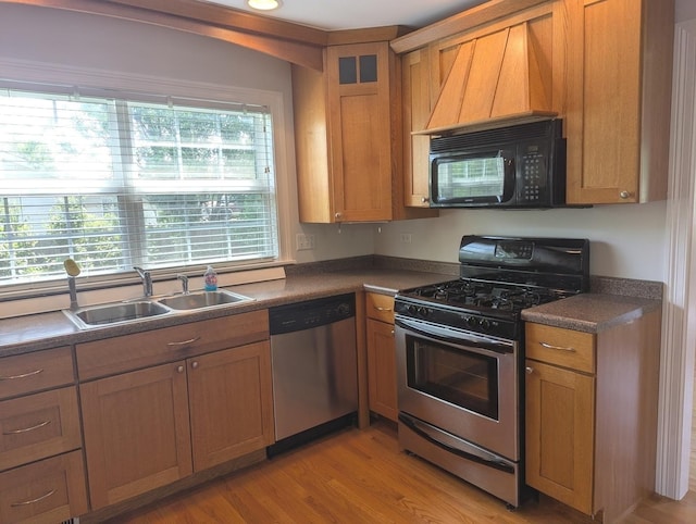 11360 195th St, Mokena, IL 60448 - kitchen with stainless steel appliances, dark countertops, light wood-type flooring, glass insert cabinets, and brown cabinetry