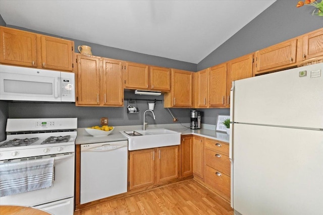 3583 Newport Dr, Island Lake, IL 60042 - kitchen with white appliances, light wood finished floors, light countertops, and vaulted ceiling