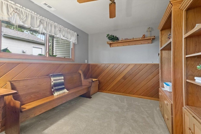 3583 Newport Dr, Island Lake, IL 60042 - living area with wainscoting, a ceiling fan, light colored carpet, and wooden walls