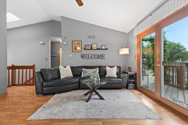 3583 Newport Dr, Island Lake, IL 60042 - living area featuring lofted ceiling, wood finished floors, and a skylight